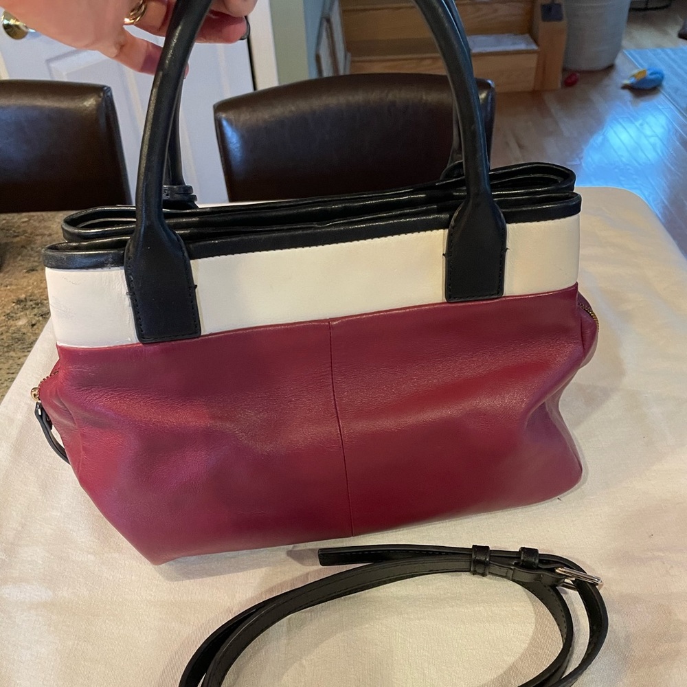 Kate Spade pocketbook, maroon, off white and black trim.